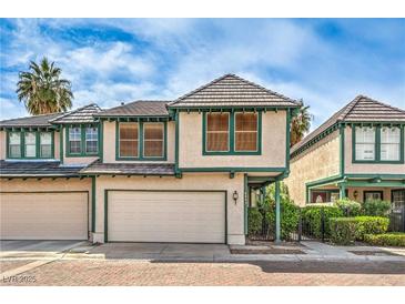 Charming two-story home featuring a two-car garage and lush landscaping at 4043 Chalfont Ct, Las Vegas, NV 89121