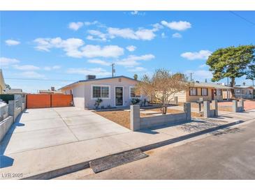 Charming single-story home with a well-maintained front yard and long driveway at 6213 Burgundy Way, Las Vegas, NV 89107