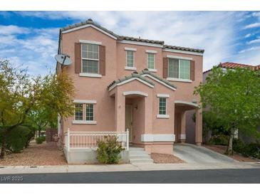 Charming two-story home with a cozy front porch and attached garage, offering a blend of comfort and convenience at 6234 Pangea Ave, Las Vegas, NV 89139