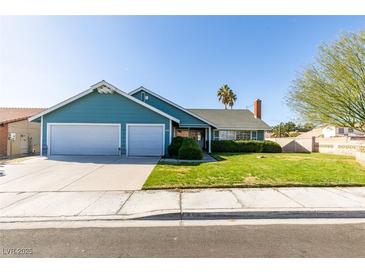 Charming single-story home with a two-car garage and a well-manicured lawn at 6357 Vicuna Dr, Las Vegas, NV 89146
