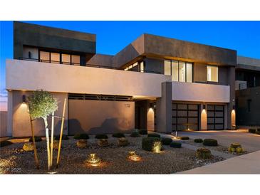 Modern two-story home featuring a landscaped front yard, desert foliage and a two car garage at 1172 Monte De Luz Way, Henderson, NV 89012