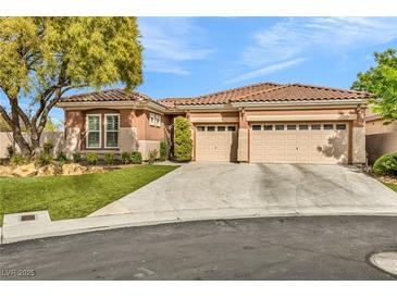 Beautiful single-story home featuring a spacious driveway and a two-car garage at 11730 Stonewall Springs Ave, Las Vegas, NV 89138