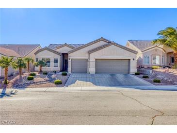 Charming single-story home with a desert landscaped front yard, and a two car garage at 3409 Cantura Bluff Ave, North Las Vegas, NV 89031