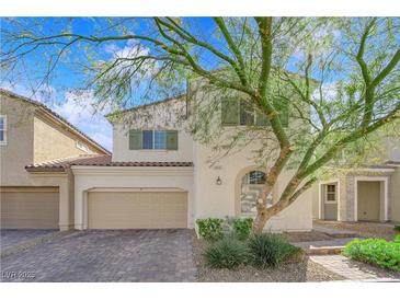 Charming two-story home with a two car garage and mature landscaping at 5832 Sleepy Willow St, Las Vegas, NV 89148