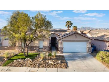 Charming single story home with a two car garage and desert landscaping at 8354 Woodland Prairie Ave, Las Vegas, NV 89129