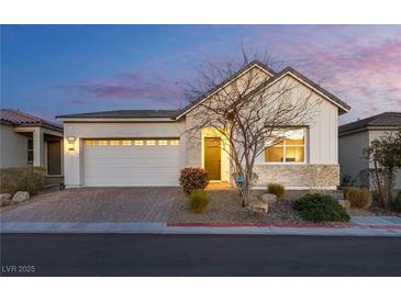 Charming single-story home with a well-manicured front yard and attached two-car garage at 8944 Skye Canyon Ranch St, Las Vegas, NV 89166
