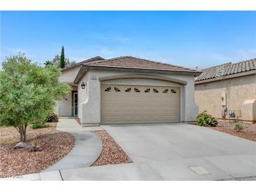 Charming single-story home featuring a two-car garage and a well-manicured front yard with desert landscaping at 2613 Country Mile Dr, Las Vegas, NV 89135