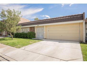 Charming single-story home featuring a well-maintained lawn, a driveway, and mature landscaping at 3287 Southridge Ave, Las Vegas, NV 89121