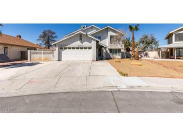 Two story home with desert landscaping and large driveway at 4121 Satinwood Dr, Las Vegas, NV 89147