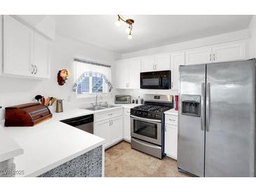 Bright kitchen featuring white cabinetry, stainless steel appliances, and neutral countertops at 4555 E Sahara Ave # 120, Las Vegas, NV 89104