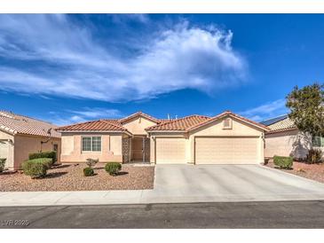 Charming single-story home featuring a well-maintained front yard and a spacious two-car garage at 6217 Statue St, North Las Vegas, NV 89081