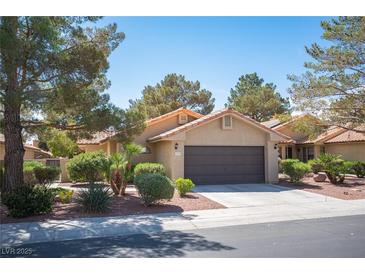 Charming single-story home featuring a two-car garage and beautiful desert landscaping at 7913 Sailboat Ln, Las Vegas, NV 89145