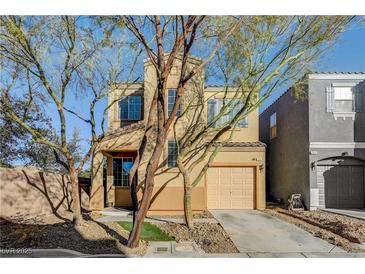 Charming two-story home featuring a well-kept yard and attached single car garage at 7506 Village Mist Ln, Las Vegas, NV 89113