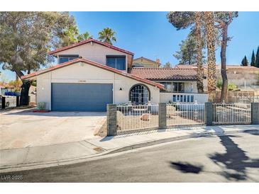 Charming two-story home with a well-maintained front yard and a two car garage at 5049 Hibbetts Ct, Las Vegas, NV 89103