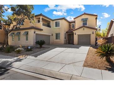 Charming two-story home with a three car garage and well-manicured front yard at 6909 Forest Gate St, North Las Vegas, NV 89084