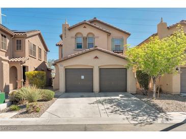Charming two-story home featuring a two-car garage and desert landscaping at 7826 Shingle Beach St, Las Vegas, NV 89166