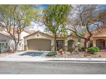 Charming single-story home with a two-car garage and well-maintained landscaping at 9446 Baltinglass St, Las Vegas, NV 89123