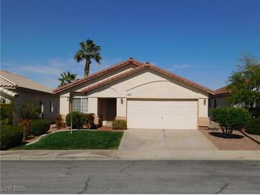 Charming single-story home with a well-maintained front yard and a two-car garage at 192 Oella Ridge Ct, Henderson, NV 89012