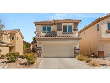 Charming two-story home with neutral stucco, a two-car garage, and manicured landscaping at 232 Dog Leg Dr, Las Vegas, NV 89148