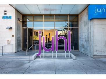 Modern building entrance featuring glass doors and the building name in large lettering at 353 E Bonneville Ave # 289, Las Vegas, NV 89101