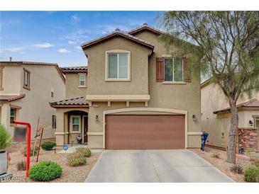 Charming two-story home with a well-maintained front yard and a two-car garage at 6470 Little Harbor Ct, Las Vegas, NV 89141