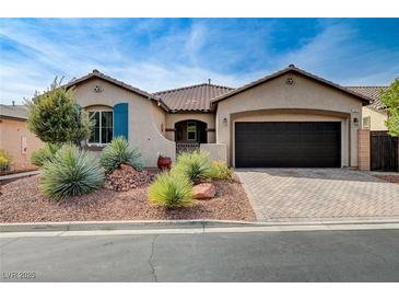 Charming single-story home with well-manicured front yard and a two-car garage at 6929 Benson Ferry St, Las Vegas, NV 89149