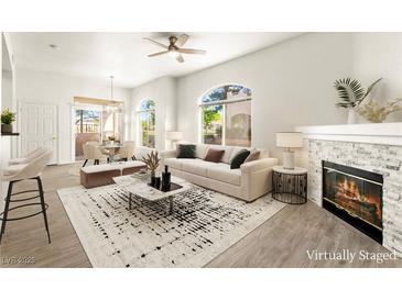 Bright living room boasts a fireplace, modern decor, and plenty of natural light at 700 Carnegie St # 3214, Henderson, NV 89052
