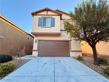 Charming two-story home with a well-manicured front yard and a two-car garage at 10145 White Mulberry Dr, Las Vegas, NV 89148