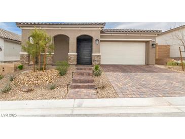 Charming single-story home with a brick driveway and well-maintained desert landscaping at 10943 Doresta Ave, Las Vegas, NV 89166