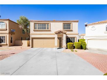 Inviting two-story home featuring a two-car garage and manicured landscaping at 3360 Cheltenham St, Las Vegas, NV 89129