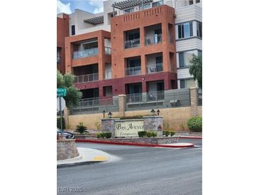 A lovely view of the condo building from street level highlighting Park Avenue Condominiums entrance and upper-level balconies at 51 E Agate Ave # 507, Las Vegas, NV 89123