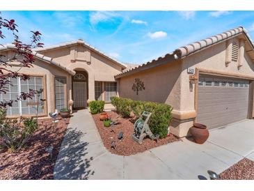 Charming single-story home featuring desert landscaping and a two-car garage at 5433 Honey Mesquite Ln, Las Vegas, NV 89130