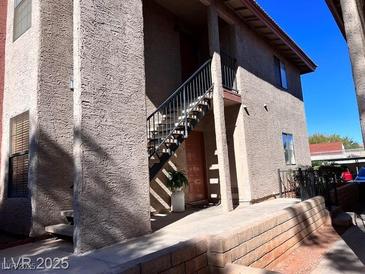 Exterior view of a two-story apartment building with stairs leading to the upper units at , Las Vegas, NV 89103