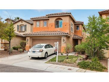 Charming two-story home features a well-maintained front yard and attached two-car garage at 11620 Longhirst Hall Ln, Las Vegas, NV 89138