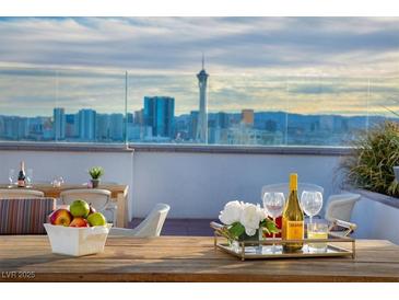 Enjoy Las Vegas views from this lovely rooftop patio with seating and a bar for entertaining at 150 Las Vegas Blvd # 918, Las Vegas, NV 89101