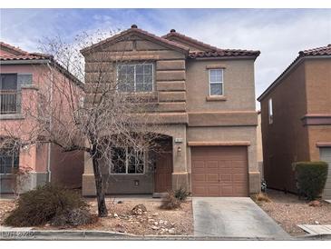 Charming two-story home with a well-maintained yard and inviting curb appeal in a suburban neighborhood at 1820 Peridot Point St, Las Vegas, NV 89106