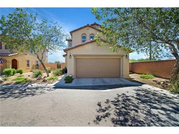 Inviting two-story home with a well-maintained front yard and attached two-car garage at 8853 Autumn Teal Ave, Las Vegas, NV 89178