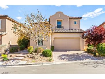 Charming two-story home featuring a neutral color palette, low maintenance landscaping, and a two-car garage at 12245 Olivetta Ct, Las Vegas, NV 89138