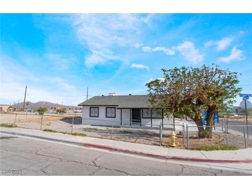 Charming single-story home with desert landscaping and a freshly painted exterior at 2716 Saber Dr, North Las Vegas, NV 89032