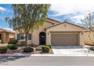 Charming single-story home featuring desert landscaping, a two-car garage and a welcoming front entrance at 4429 S Glory Vine Ln, Pahrump, NV 89061