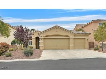 Charming single-story home featuring a three-car garage and well-maintained desert landscaping at 5835 Farmhouse Ct, Las Vegas, NV 89141