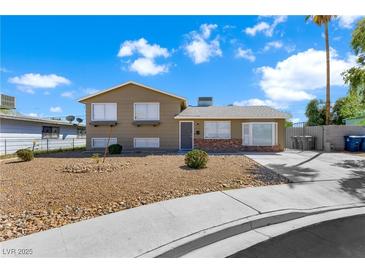 Charming two-story home featuring well-maintained landscaping and a spacious driveway at 6121 Dayton Cir, Las Vegas, NV 89107