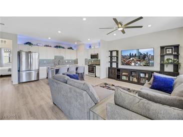 Bright, open-concept living space with modern decor and a seamless flow to the kitchen island at 1180 Solano Hills Ct, Henderson, NV 89002