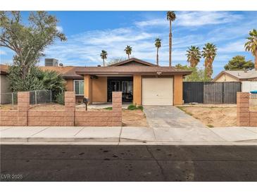 Charming single-story home featuring a well-maintained front yard and attached one-car garage at 14 Page St, Las Vegas, NV 89110