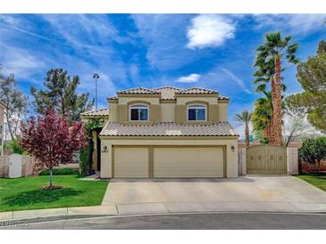 Charming two-story home featuring a well-manicured lawn, mature trees, and a convenient two-car garage at 2073 Sapphire Valley Ave, Henderson, NV 89074