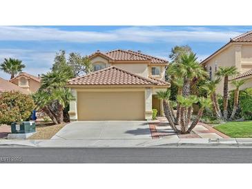 Charming two-story home with red tile roof, desert landscaping and a two car garage at 2324 Babcock Dr, Las Vegas, NV 89134