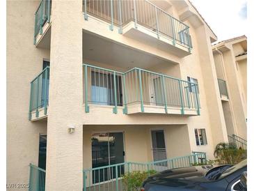 Three story condominium featuring balconies with metal railings and textured facade at 3550 Bay Sands Dr # 2016, Laughlin, NV 89029