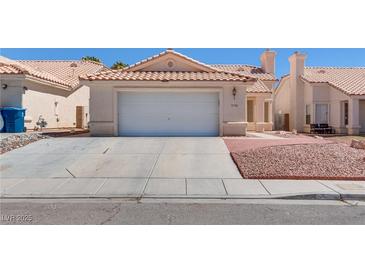 Charming single-story home with a well-maintained lawn and a two-car garage at 3750 Horseshoe Mesa St, Las Vegas, NV 89147