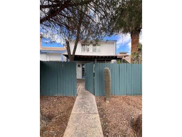 Charming two-story home with a well-maintained yard and a decorative cactus near the walkway at 4239 White Sands Ave, Las Vegas, NV 89121