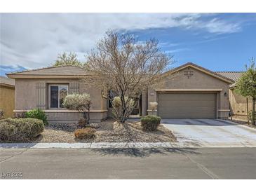 Charming single-story home with desert landscaping, an attached garage, and a well-maintained yard at 5505 Criollo Dr, Las Vegas, NV 89122